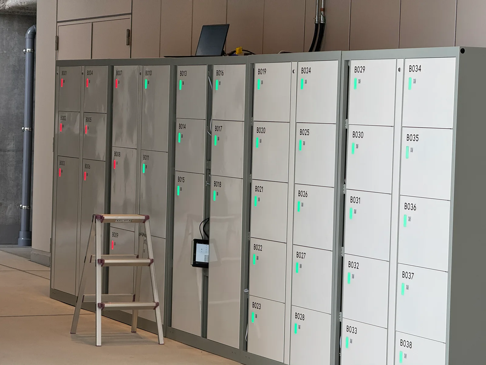 A KEYVOX Smart Locker with a control panel and rows of boxes